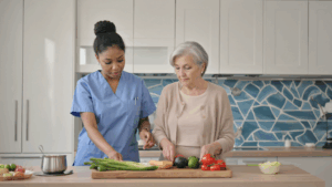 Dementia care specialist supporting a senior with memory care at a Sunrise or Brighton Gardens assisted living community in New Jersey