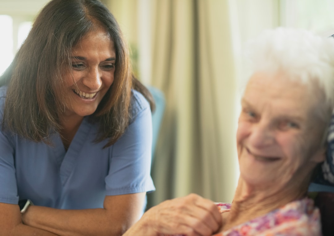 Certified home health aide providing care for senior at home in New Jersey